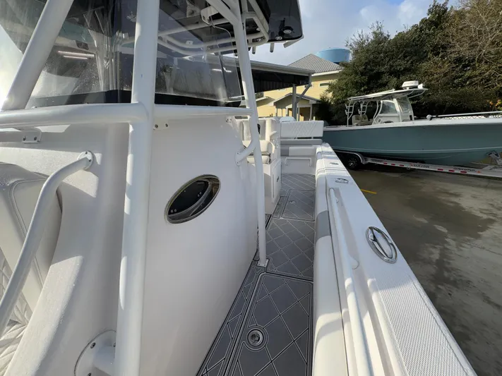  Yacht Photos Pics 2018 Fountain 34 CC boat, side view, docked with sleek design and modern features.