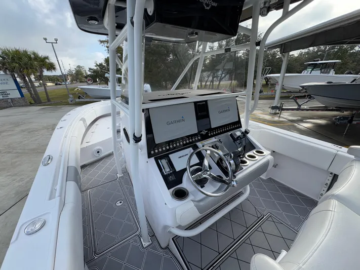  Yacht Photos Pics 2018 Fountain 34 CC boat interior with dual Garmin displays and steering wheel.