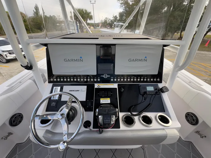  Yacht Photos Pics 2018 Fountain 34 CC boat dashboard with Garmin displays and Mercury controls.