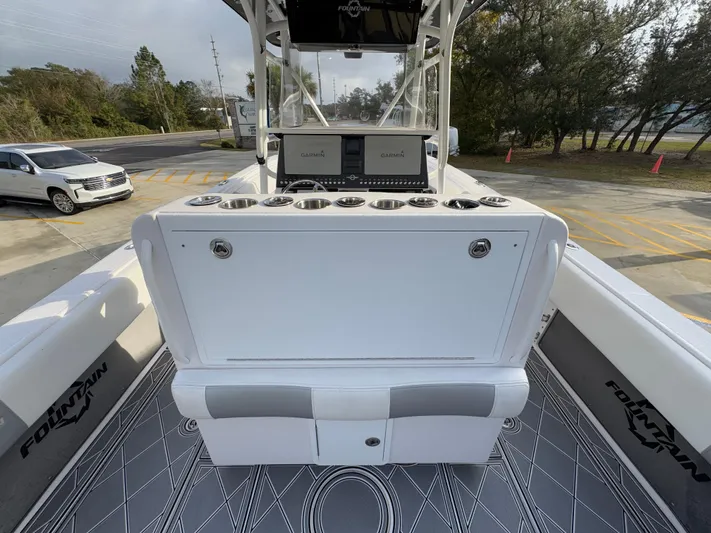  Yacht Photos Pics 2018 Fountain 34 CC boat interior with console and seating.