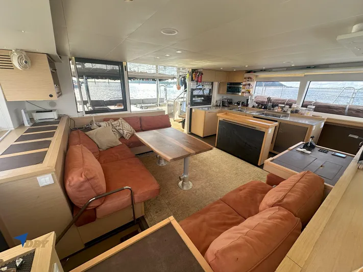 Samadhi Yacht Photos Pics Spacious interior of 2019 Lagoon 560 S2 catamaran with modern kitchen and comfortable seating.