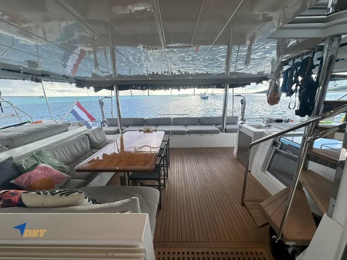 Samadhi Yacht Photos Pics Spacious interior of 2019 Lagoon 560 S2 yacht with ocean view and comfortable seating.