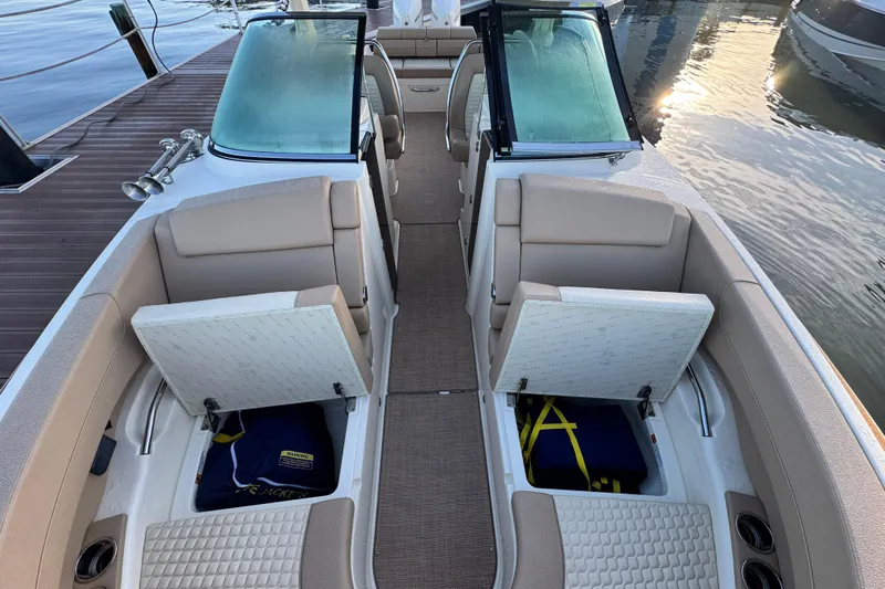  Yacht Photos Pics 2021 Chris-Craft Launch 31 GT boat interior with open storage compartments and beige seating.