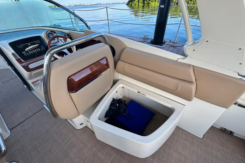  Yacht Photos Pics 2021 Chris-Craft Launch 31 GT interior with storage compartment and dashboard view.
