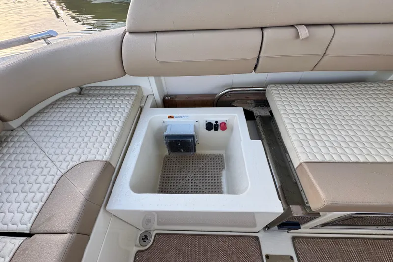  Yacht Photos Pics 2021 Chris-Craft Launch 31 GT boat interior with cushioned seating and storage compartment.
