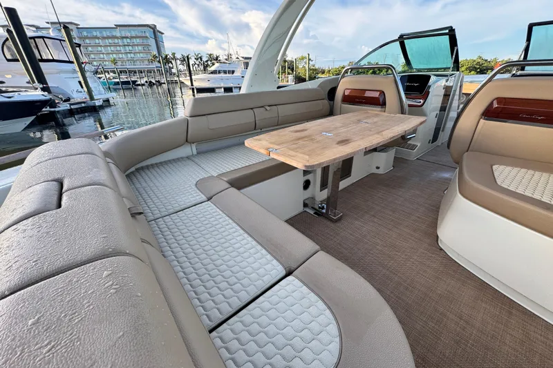 Yacht Photos Pics Luxurious interior of 2021 Chris-Craft Launch 31 GT boat with elegant seating and table.