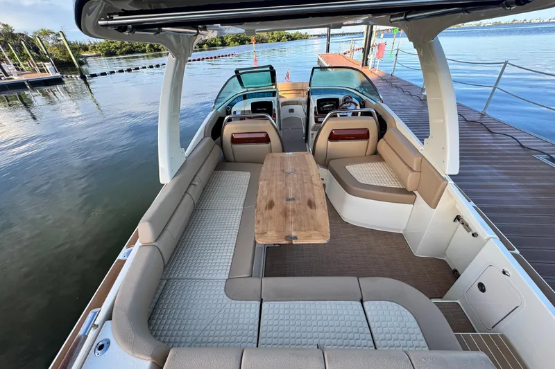  Yacht Photos Pics 2021 Chris-Craft Launch 31 GT boat interior with spacious seating and wooden table.