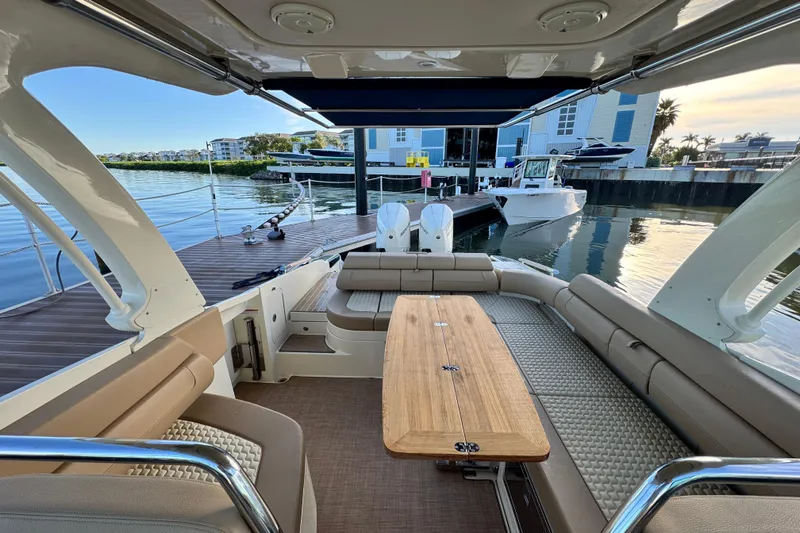  Yacht Photos Pics 2021 Chris-Craft Launch 31 GT boat interior with seating and table, docked at marina.