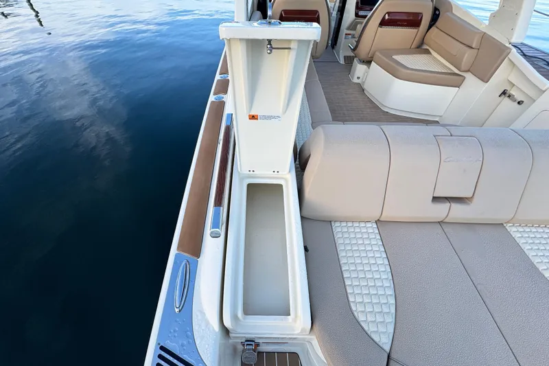  Yacht Photos Pics 2021 Chris-Craft Launch 31 GT boat interior with open storage compartment and seating.