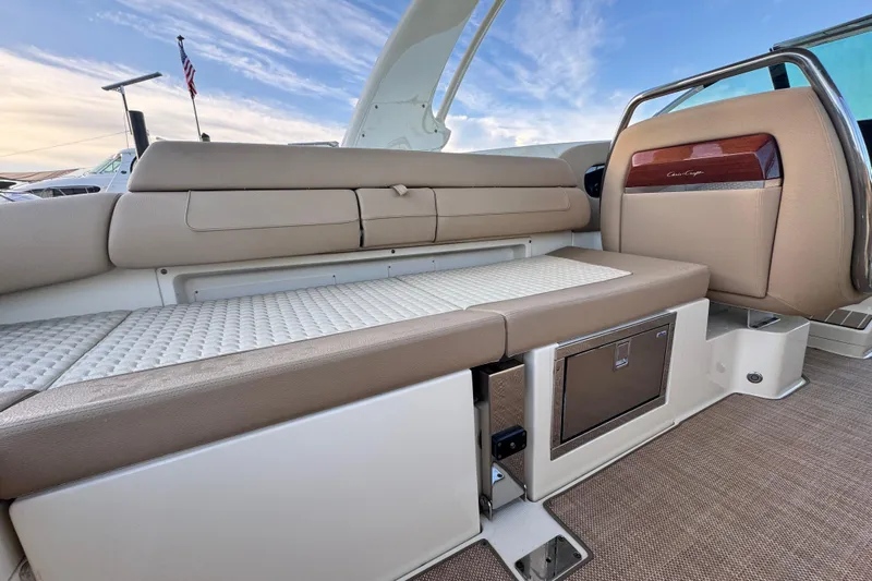  Yacht Photos Pics 2021 Chris-Craft Launch 31 GT interior with beige seating and storage compartments.