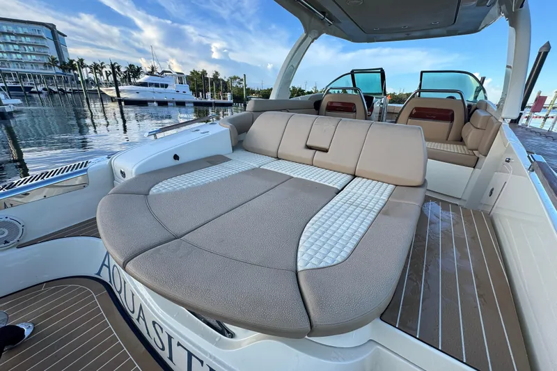 Yacht Photos Pics 2021 Chris-Craft Launch 31 GT boat interior with luxurious seating at marina.