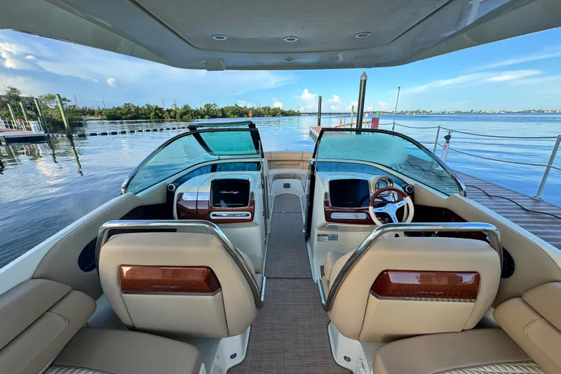  Yacht Photos Pics 2021 Chris-Craft Launch 31 GT boat interior with luxurious seating and scenic water view.