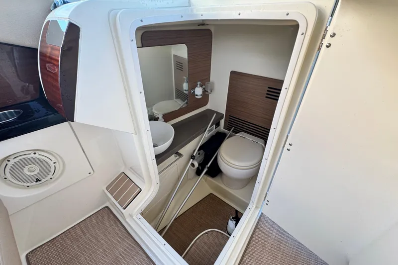  Yacht Photos Pics 2021 Chris-Craft Launch 31 GT boat interior with compact bathroom and modern amenities.