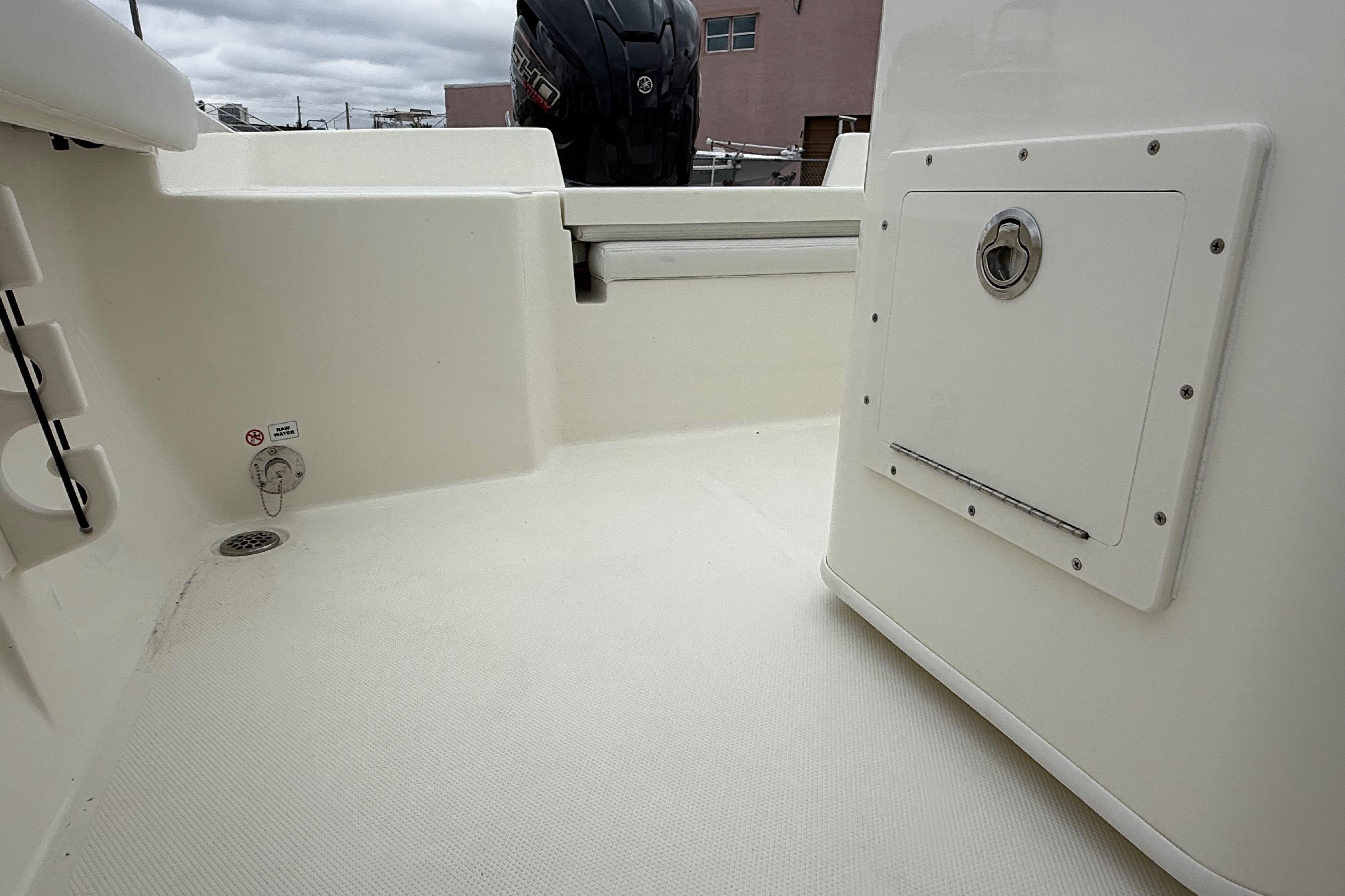 2026 Pathfinder 2400 TRS boat interior, featuring storage compartment and clean deck design.