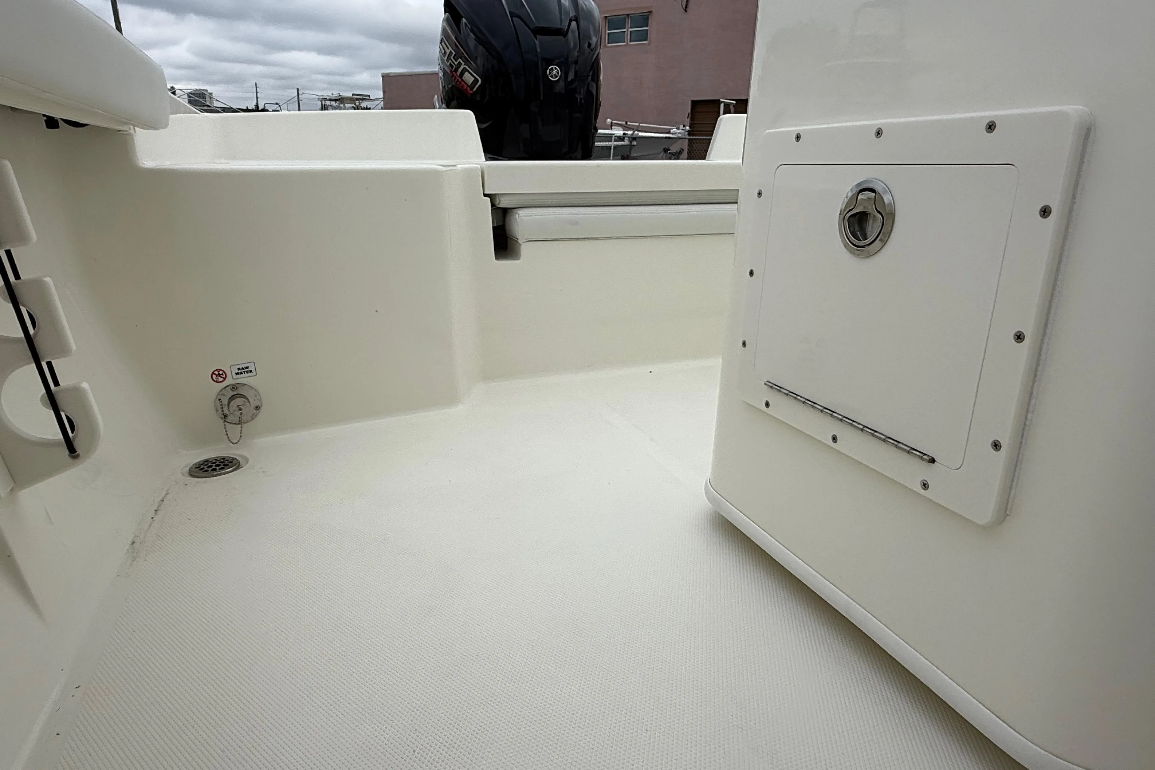 2026 Pathfinder 2400 TRS boat interior, featuring storage compartment and clean deck design.