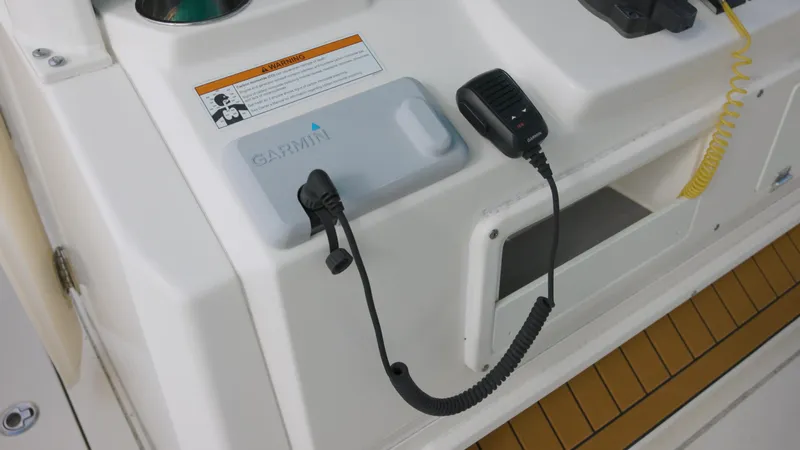  Yacht Photos Pics Cobia 350 Center Console 2022 boat dashboard with Garmin device and microphone.