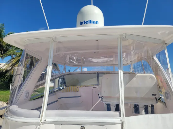  Yacht Photos Pics 2016 Intrepid 475 Sport Yacht with clear enclosure and Intellian satellite dome.