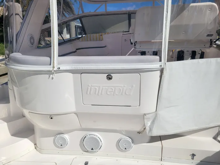  Yacht Photos Pics 2016 Intrepid 475 Sport Yacht, rear view with seating and clear enclosure.