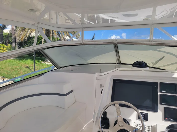  Yacht Photos Pics 2016 Intrepid 475 Sport Yacht helm with modern controls and panoramic view.