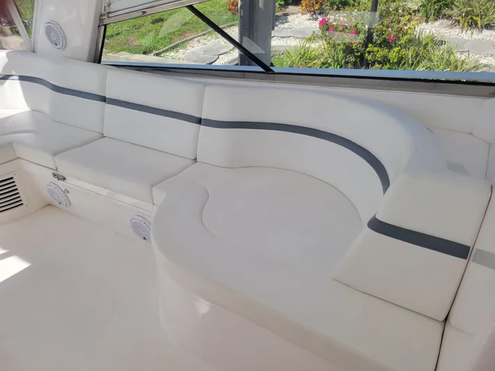  Yacht Photos Pics Luxurious seating area on a 2016 Intrepid 475 Sport Yacht with white cushions.