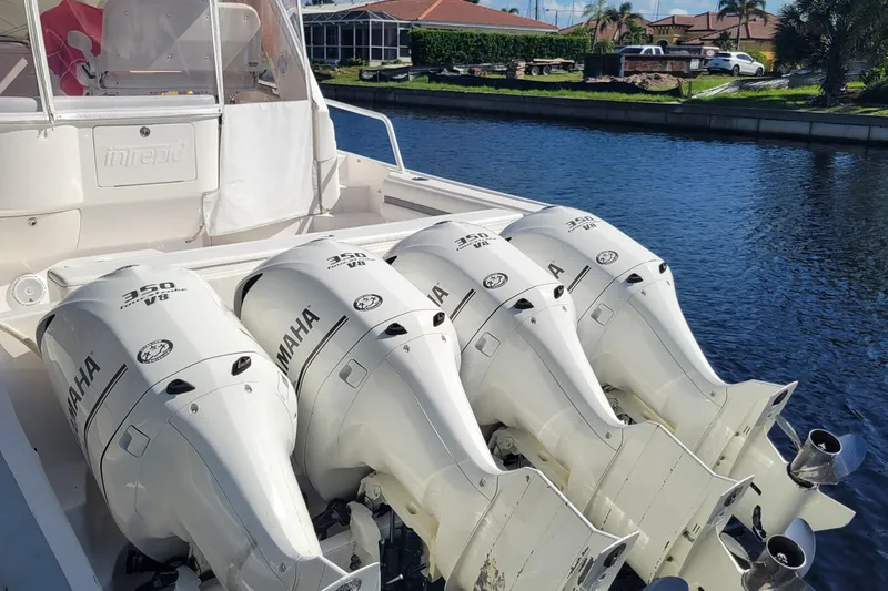  Yacht Photos Pics 2016 Intrepid 475 Sport Yacht with four Yamaha 350 V8 engines on a sunny waterfront.