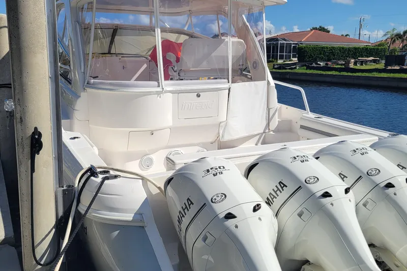  Yacht Photos Pics 2016 Intrepid 475 Sport Yacht with four Yamaha 350 V8 engines docked by a canal.