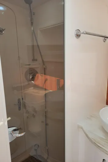  Yacht Photos Pics Bathroom interior of 2016 Intrepid 475 Sport Yacht with shower and sink.