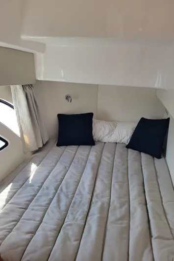  Yacht Photos Pics Interior cabin of 2016 Intrepid 475 Sport Yacht with bed and pillows.