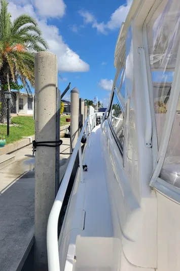  Yacht Photos Pics 2016 Intrepid 475 Sport Yacht docked under clear blue sky.