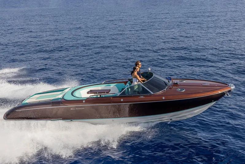 Bacio Yacht Photos Pics 2023 Riva Anniversario luxury yacht cruising on open water.