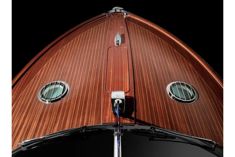 Bacio Yacht Photos Pics 2023 Riva Anniversario yacht with sleek wooden deck and circular windows.