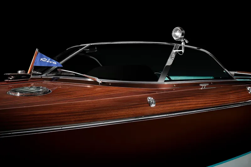 Bacio Yacht Photos Pics 2023 Riva Anniversario boat with sleek wooden finish and elegant design details.