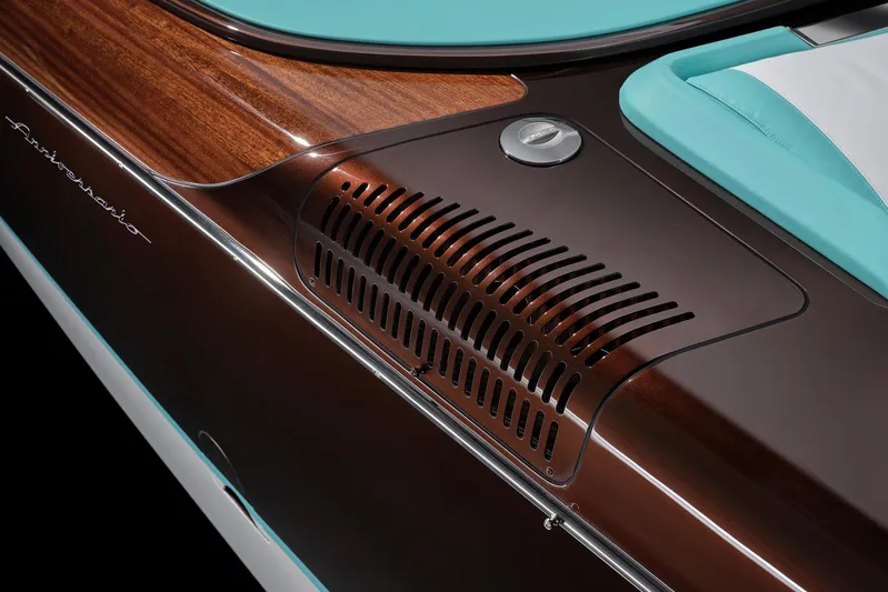 Bacio Yacht Photos Pics 2023 Riva Anniversario boat detail with sleek wood finish and turquoise accents.