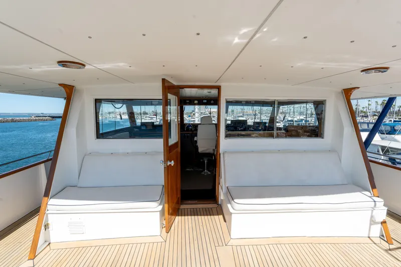 Nordic Star Yacht Photos Pics Luxurious 1969 Custom Hargrave yacht interior with white seating and ocean view.