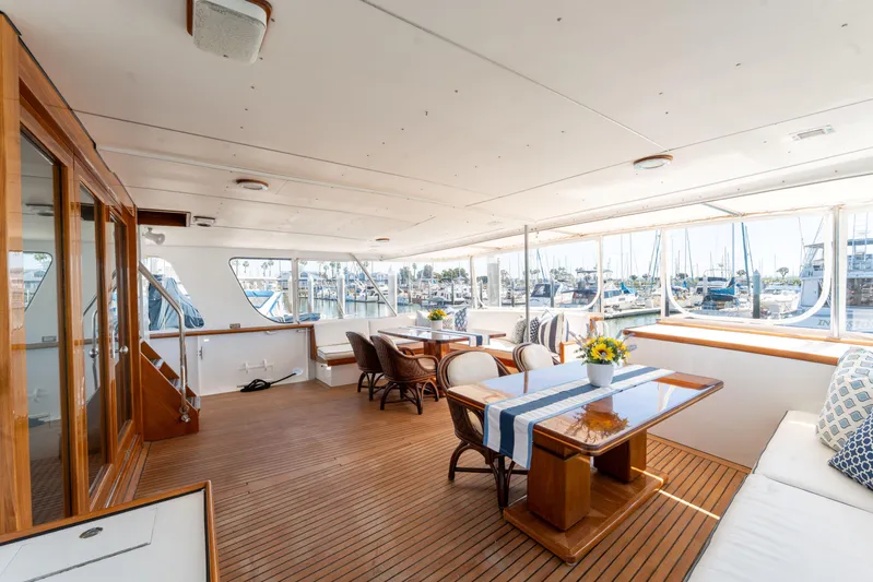 Nordic Star Yacht Photos Pics Luxurious 1969 Custom Hargrave yacht interior with elegant dining area and marina view.