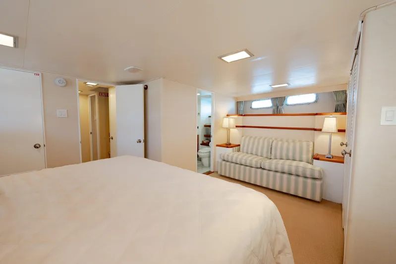 Nordic Star Yacht Photos Pics Luxurious 1969 Custom Hargrave yacht interior with cozy bedroom and elegant seating area.