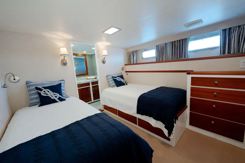 Nordic Star Yacht Photos Pics Luxurious 1969 Custom Hargrave yacht bedroom with twin beds and elegant decor.