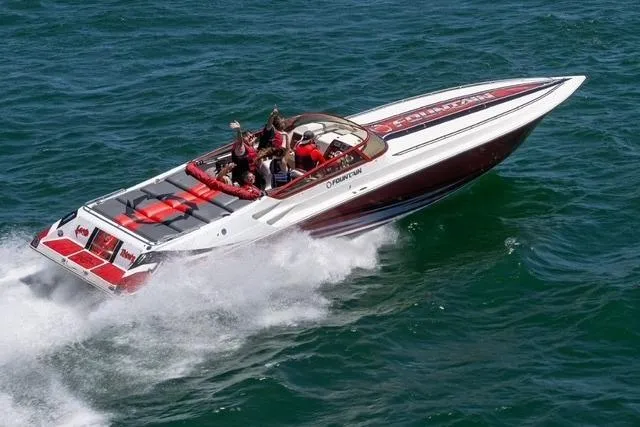  Yacht Photos Pics 2006 Fountain 42 Lightning speedboat cruising on open water, showcasing sleek design and performance.