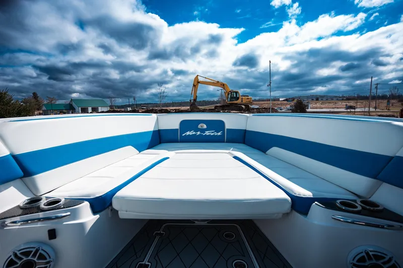  Yacht Photos Pics 2017 Nor-Tech 390 Sport Center Console boat with blue and white seating, under cloudy sky.