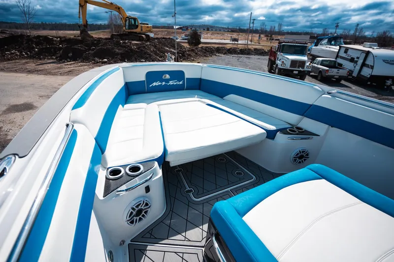  Yacht Photos Pics 2017 Nor-Tech 390 Sport Center Console boat interior with blue and white seating.