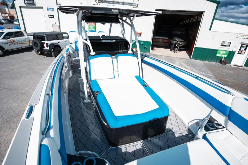 Yacht Photos Pics 2017 Nor-Tech 390 Sport Center Console boat with blue and white seating, docked outdoors.