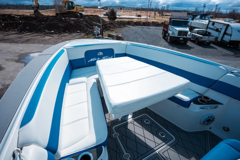  Yacht Photos Pics 2017 Nor-Tech 390 Sport Center Console with blue and white seating and table.