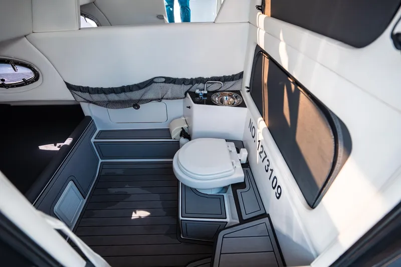  Yacht Photos Pics 2017 Nor-Tech 390 Sport Center Console interior with modern marine toilet and sleek design.