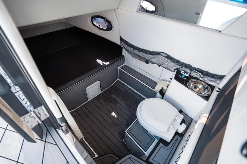  Yacht Photos Pics 2017 Nor-Tech 390 Sport Center Console cabin with toilet and sink.