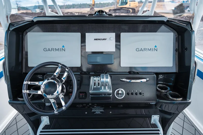  Yacht Photos Pics 2017 Nor-Tech 390 Sport Center Console dashboard with Garmin displays and Mercury controls.