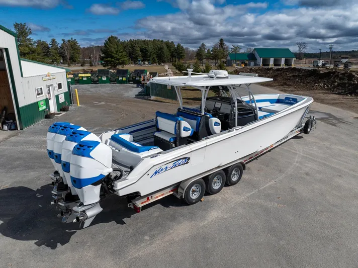  Yacht Photos Pics 2017 Nor-Tech 390 Sport Center Console boat with triple engines on a trailer.