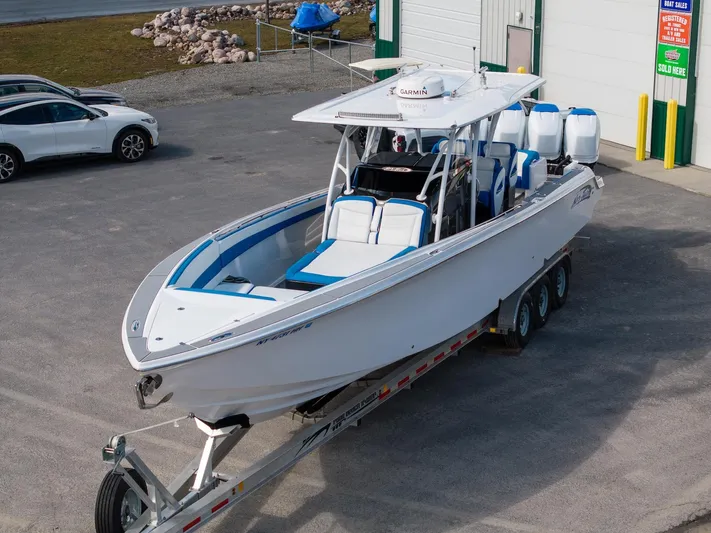  Yacht Photos Pics 2017 Nor-Tech 390 Sport Center Console boat on trailer, parked outside.