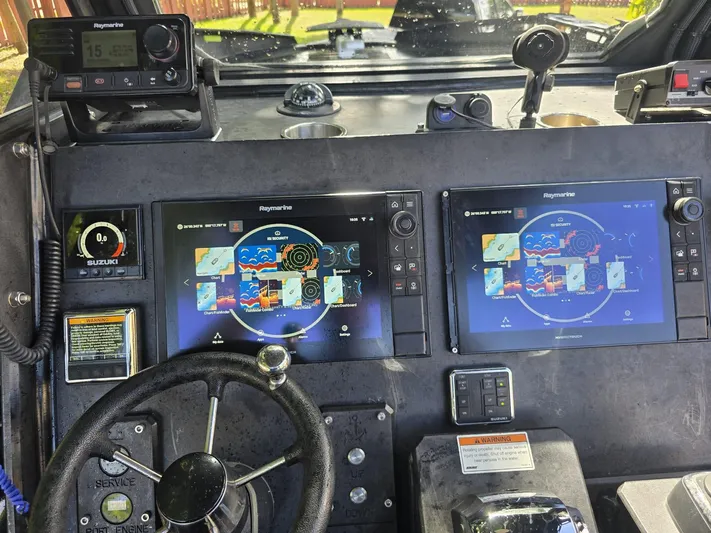 Dgs777 Yacht Photos Pics Cockpit of 2022 DGS 777 Military Version with dual Raymarine displays and controls.