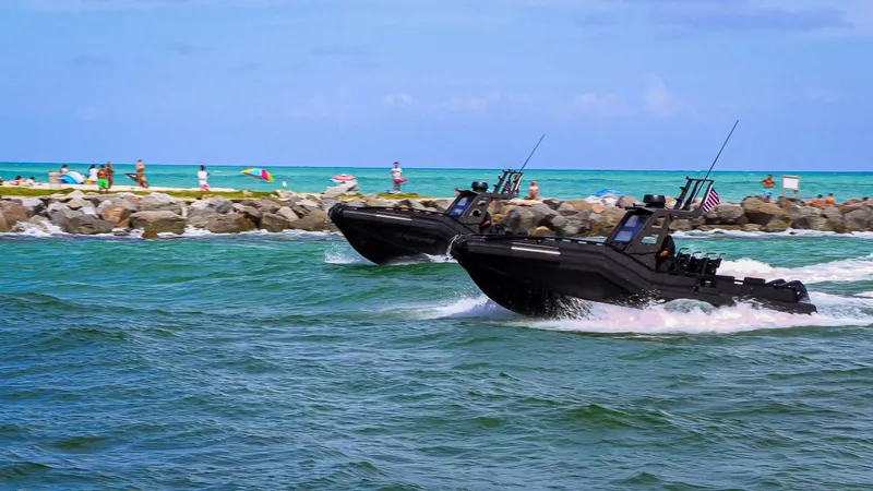 Dgs777 Yacht Photos Pics Two DGS 777 Military boats speeding on ocean near rocky shore, 2022 model.