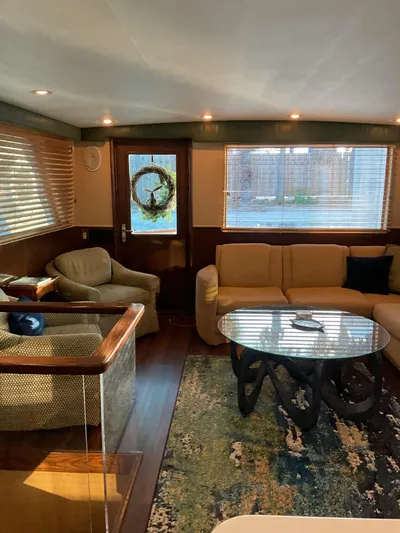 Reflections Yacht Photos Pics Luxurious interior of 1993 Hatteras 60 ED yacht with elegant seating and modern decor.